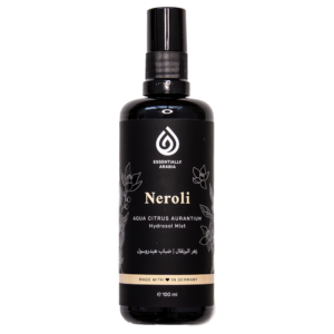 close-up photo of Essentially Arabia's Neroli Hydrosol bottle, which has a black color with light-orange details representing the uplifting effect of neroli